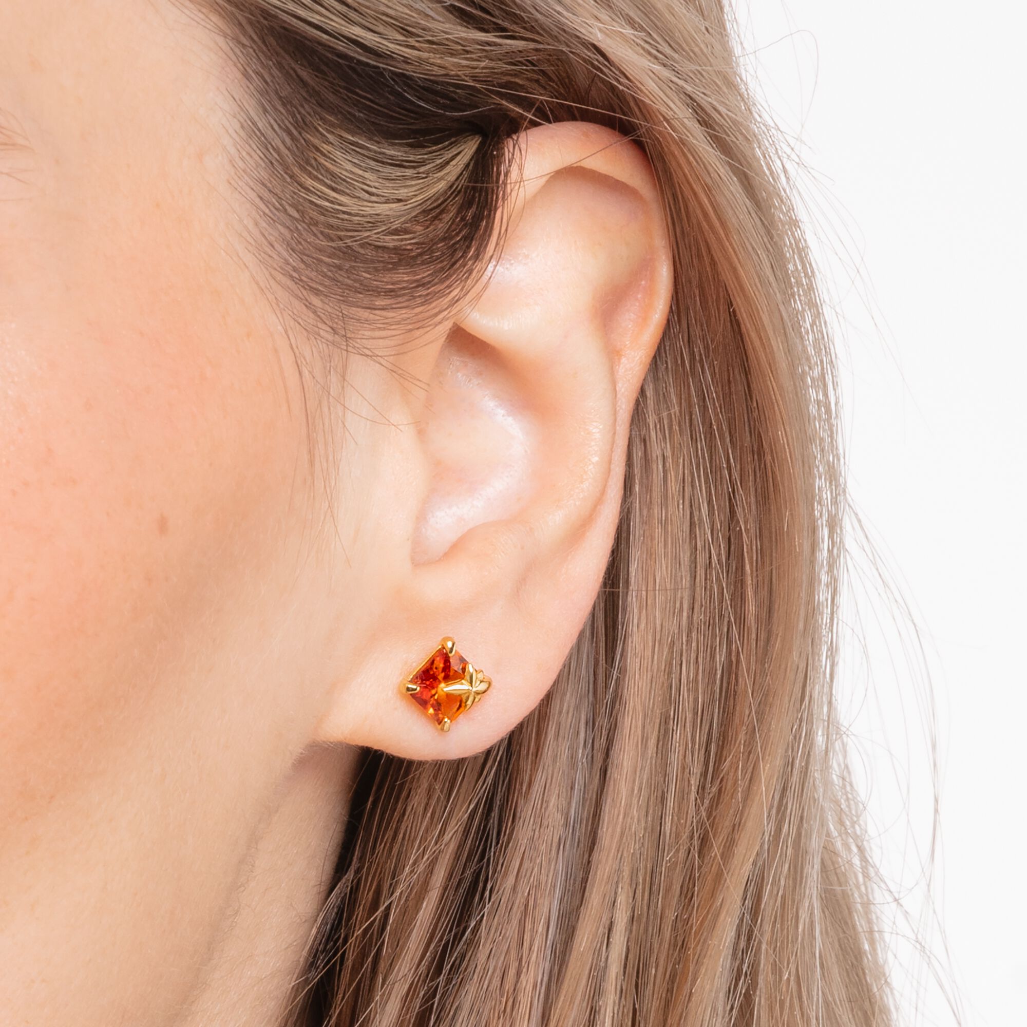 Clous d'oreilles avec pierre orange et étoile plaqué or | THOMAS SABO